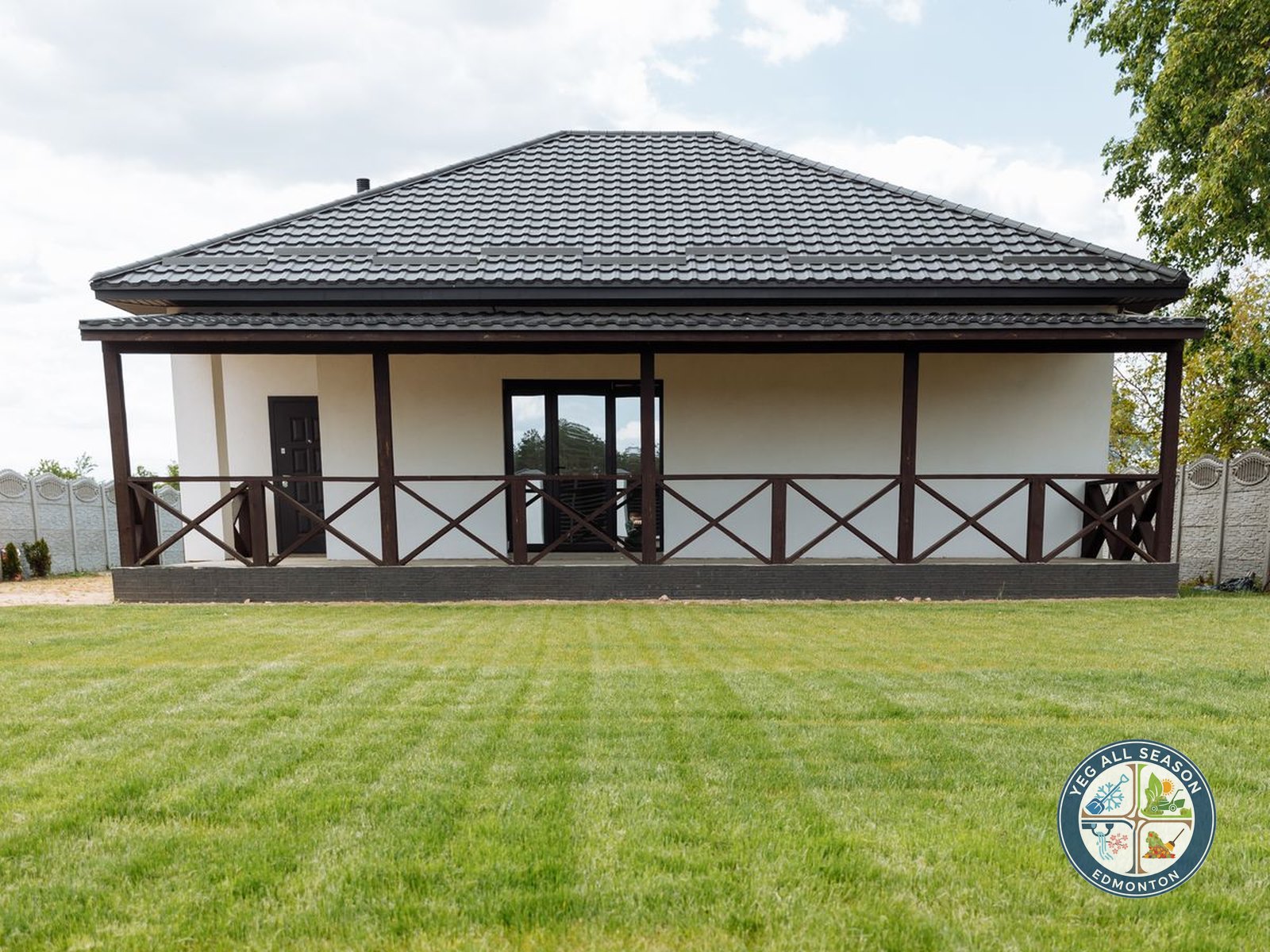 Edmonton area home with a freshly cut lawn maintained by YEGAllSeason